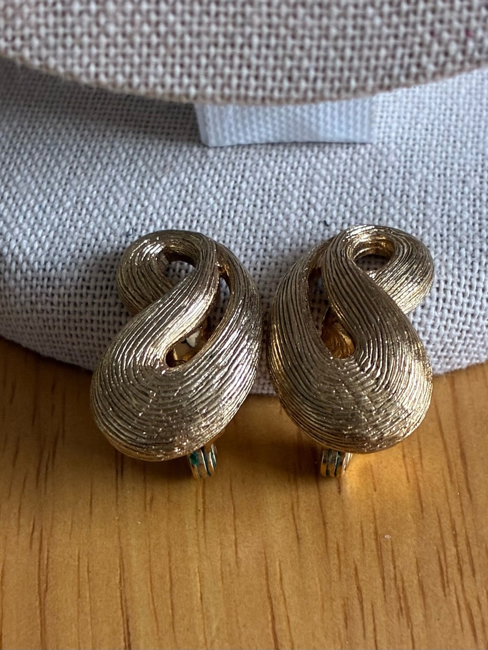 These are Vintage Monet Gold ToneTextured Swirl Clip-On Earrings Women Jewelry.